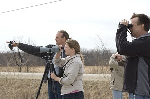 Picture of people looking through a spotting scope