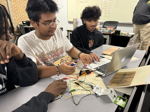 Students in Storm Lake's ASCEND program explore the functions of Microbits ahead of a class challenge.