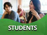 two students talking about technology in a meeting