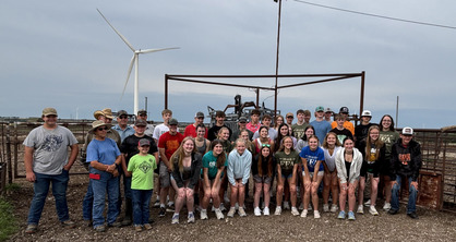 The group visited a family farm where they learned about their diversified operation of grains, cattle, and custom farming.