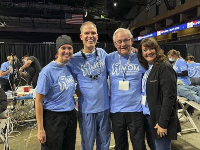 Picture of Iowa Dental Foundation members at the annual Iowa Mission of Mercy event posing for a picture 