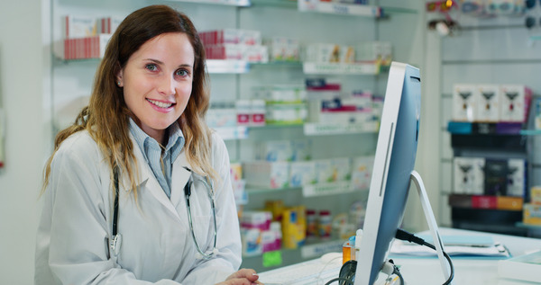 Image of pharmacist at computer