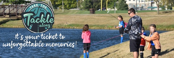 A man and kids fishing at a community fishing pond.