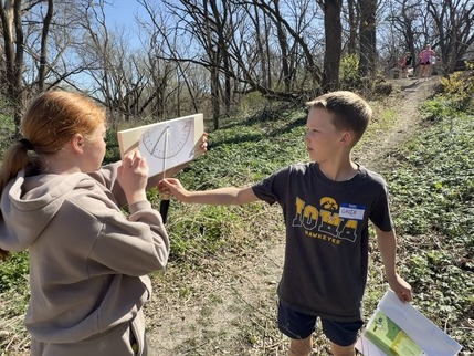 Students measure the slop of a trail