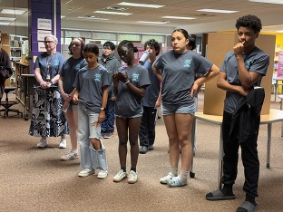 Pam with several of the 7th grade students