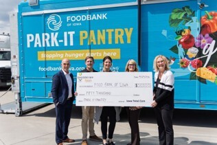 Iowa Total Care team at a food bank