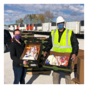 Image of Abigail, our Community Health Administrator, organizing deliver of USDA Farmers to Families food boxes during the COIVD-19 pandemic