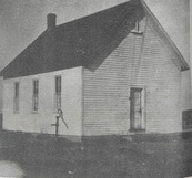 A one-room schoolhouse that was located in Washington Township, Dallas County