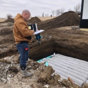 Ted inspects a septic system