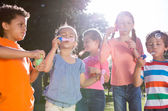 Children blowing bubbles image