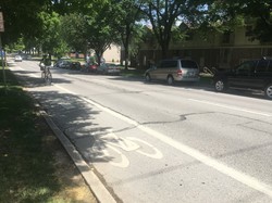 Image of a bike lane on the corner of Jefferson and Van Buren streets