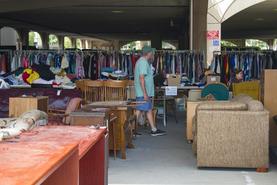 Photo of man shopping in rummage sale
