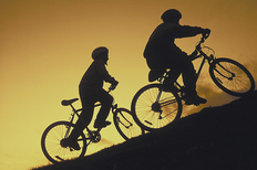 Cyclists riding up a hill