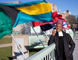 Kuann Fawkes with the Bahamas flag