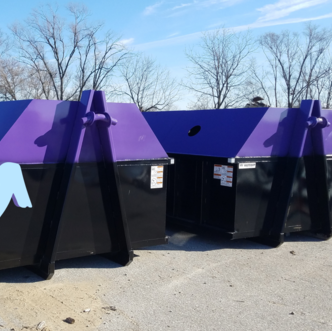 large metal bins with purple on top