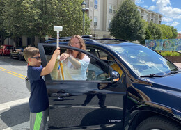NOAA coordinator and volunteer prepare to collect heat island data