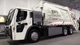 an electric garbage truck is pictured