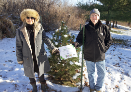 Mark and Nancy are pictured with their Emerald Arrow Pine