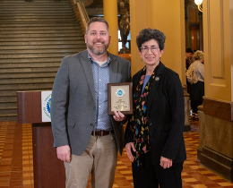 Jesse Bulman and Janet Weiner are pictured with the award