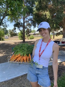 Photo: Woman holding carrots