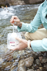 Water being tested from a river