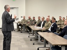 Photo of Governor Little speaking to a group at the IRT Training