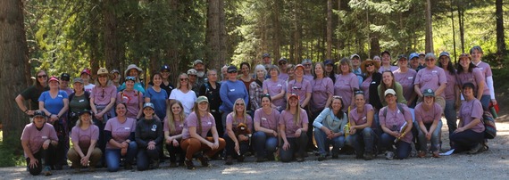 women in woods group photo