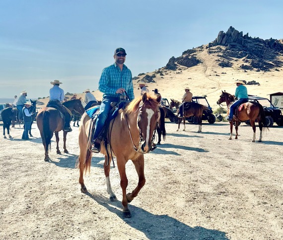 Director Miller on a horse participating in the governor's ride