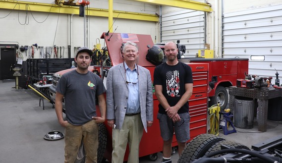 Gov in the shop with IDL employees