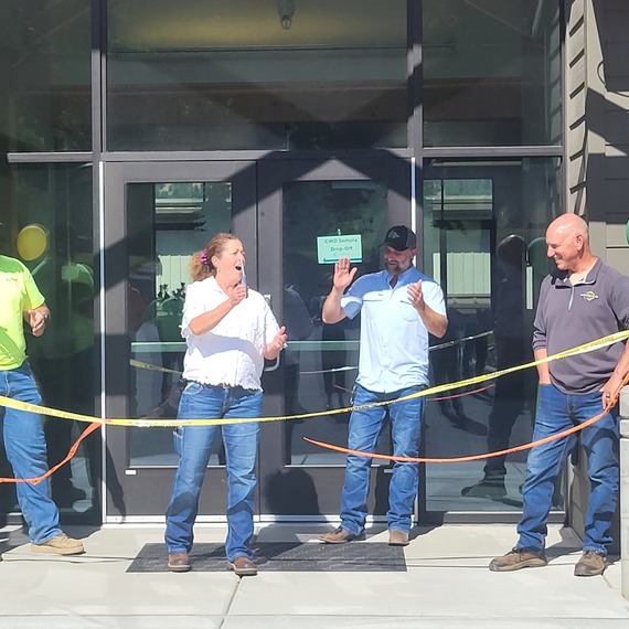 Deputy Director cutting a ribbon