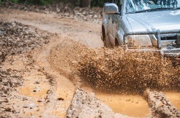 truck driving in deep mud