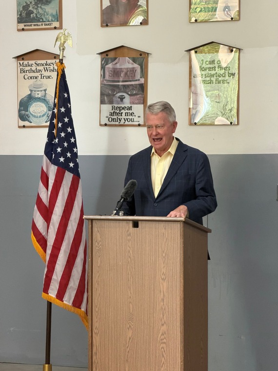 Governor Little speaking at news conference