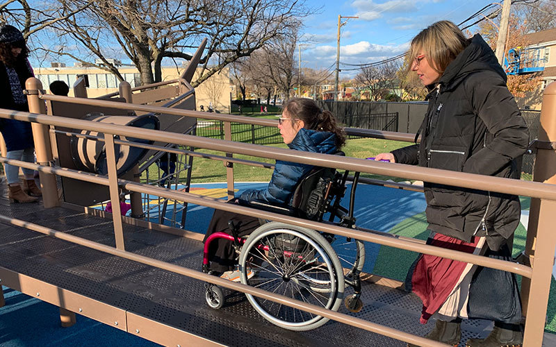 Person using wheelchair at accessible playground