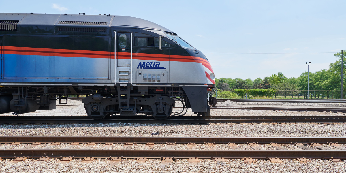 A Metra train is shown on tracks