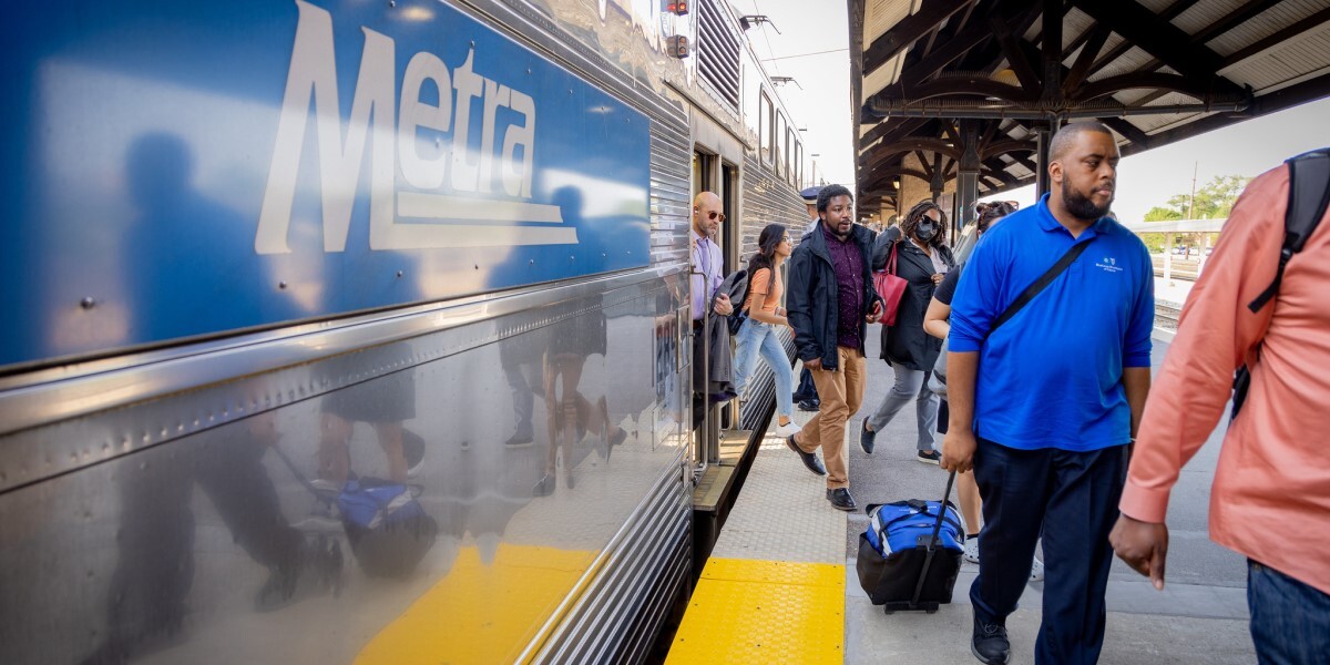 People getting off a Metra train