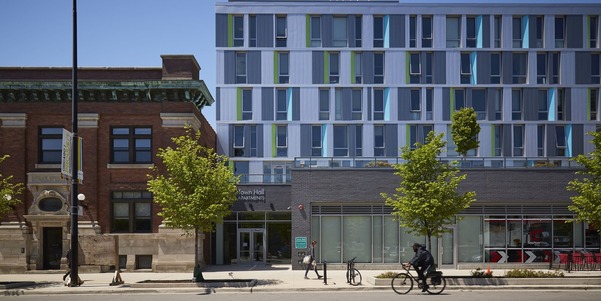 Modern apartment building next to 19th-century building