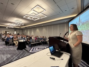 Erin addressing conference attendees