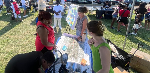 CMAP engaging with community members at community event