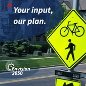 Image of pedestrian sign with text 'Your input, our plan'