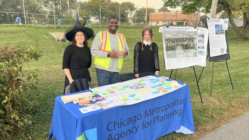 CMAP staff dressed in halloween costumes engage with Maywood residents