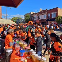 CMAP staff dressed in halloween costumes engage with Maywood residents