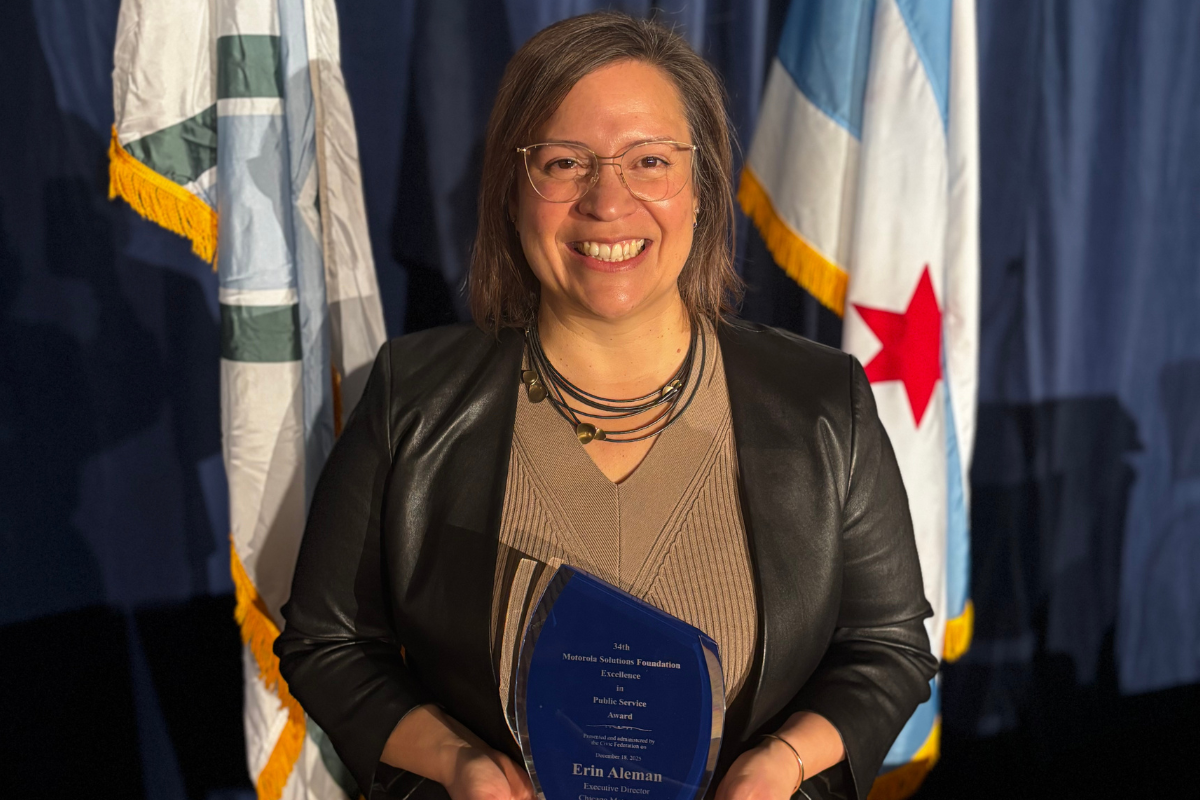 Erin Aleman posing with Motorola Solutions Foundation Excellence in Public Service Award