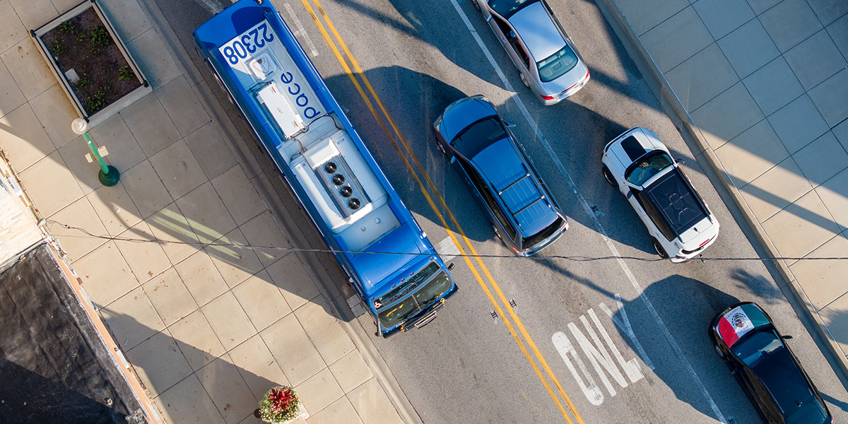 Ariel shot of vehicles driving down street in two directions