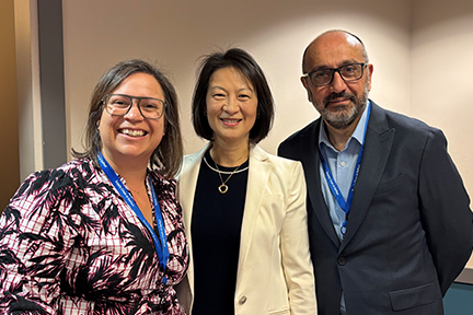 CMAP Executive Director Erin Aleman posing with DePaul Dean Sulin Ba and Professor Nezih Altay
