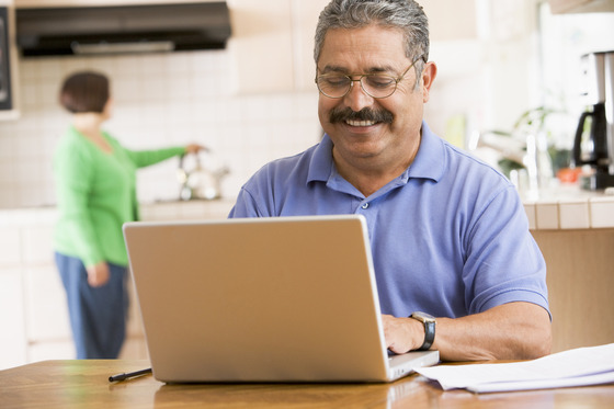 Senior man filling out an exemption form