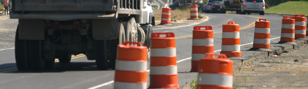 Truck on road with traffic barriers