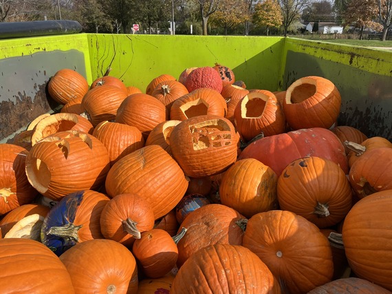 Dumpster Filled with Pumpkins