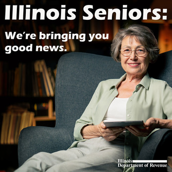 Woman sitting in a chair, holding a tablet.