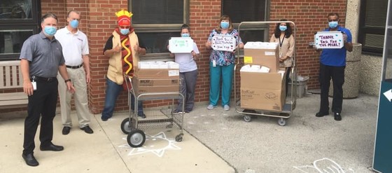 Board members deliver meals to Care Center
