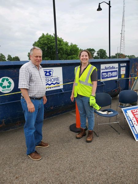 Board member Grant Eckhoff helped staff and residents during a sign recycling event on July 9